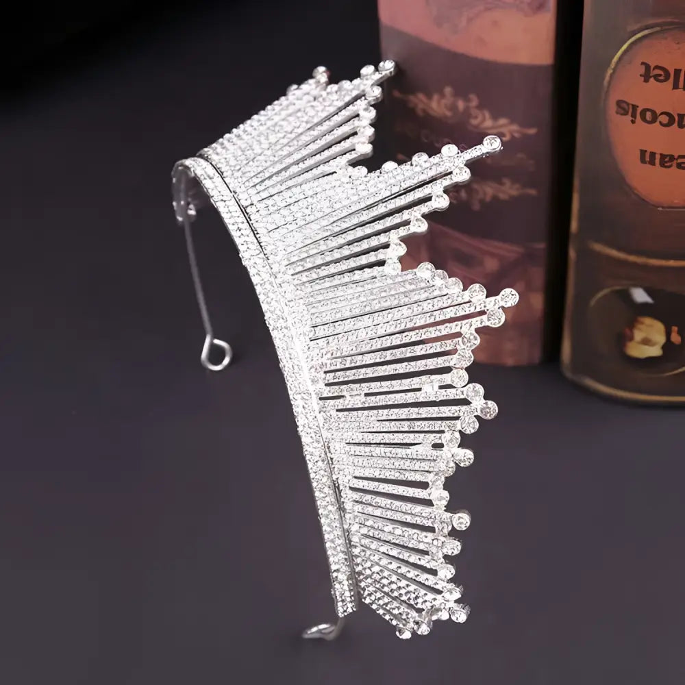 A sparkling silver european birthday headdress crown adorned with clear crystals and intricate fan-like prongs