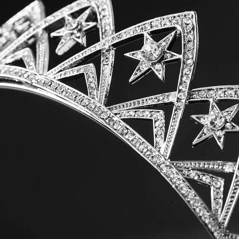 Silver tiara with sparkling rhinestones and star-shaped embellishments from european wedding xingx bridal crown collection