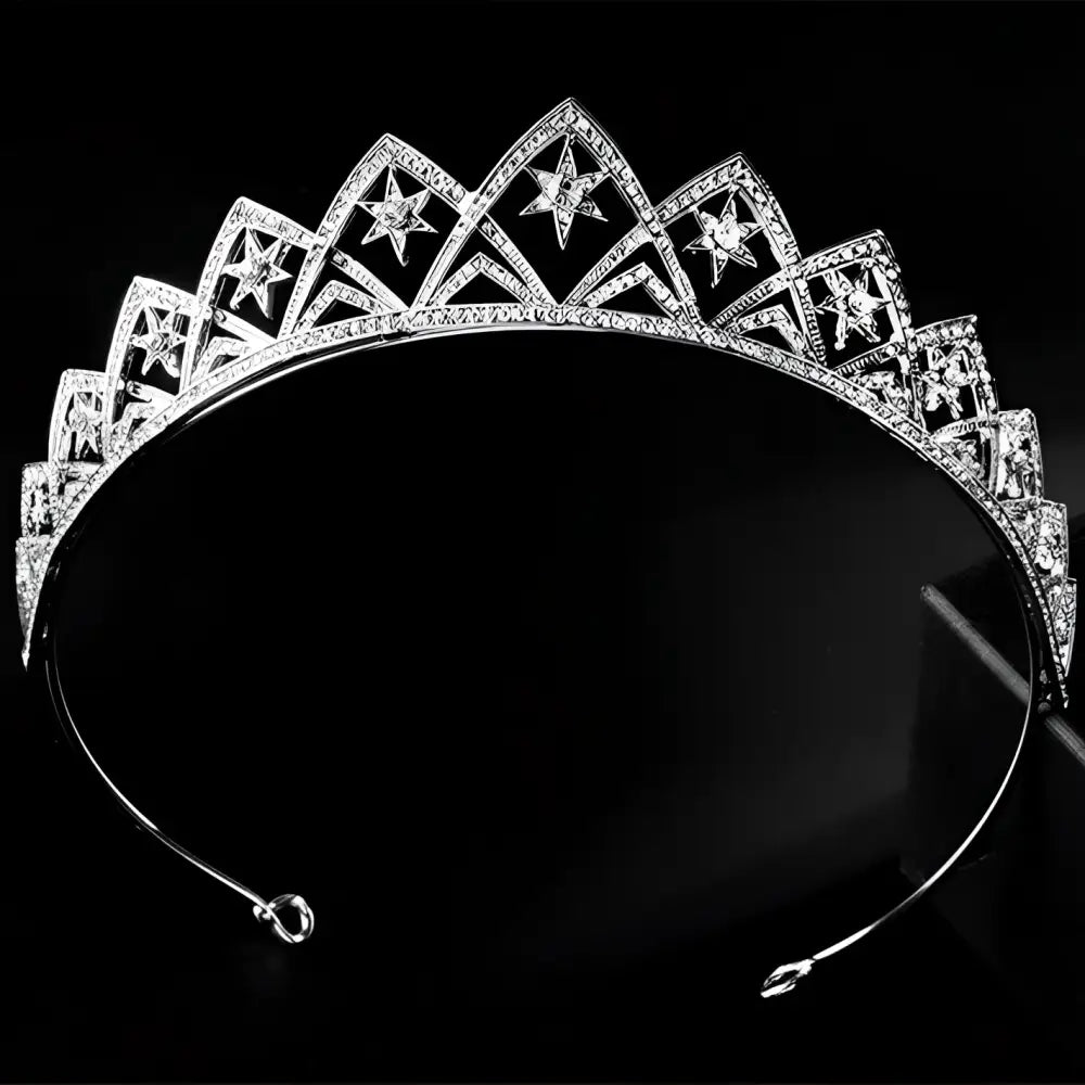 A sparkling silver european wedding xingx bridal crown tiara with intricate star-shaped cutouts and embedded crystals