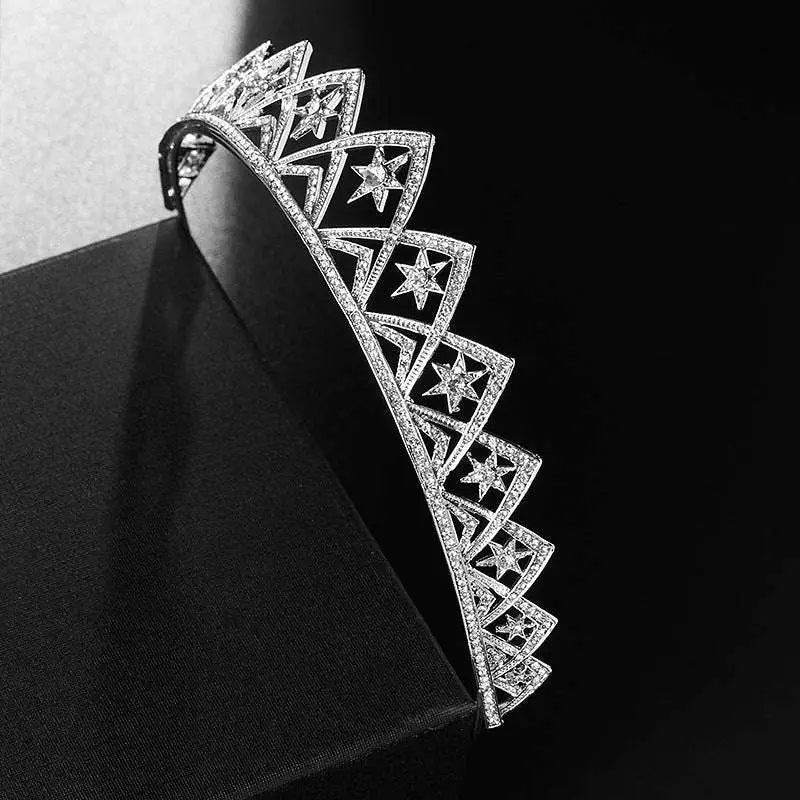 A sparkling silver european wedding xingx bridal crown featuring intricate star-shaped diamond patterns and a geometric design