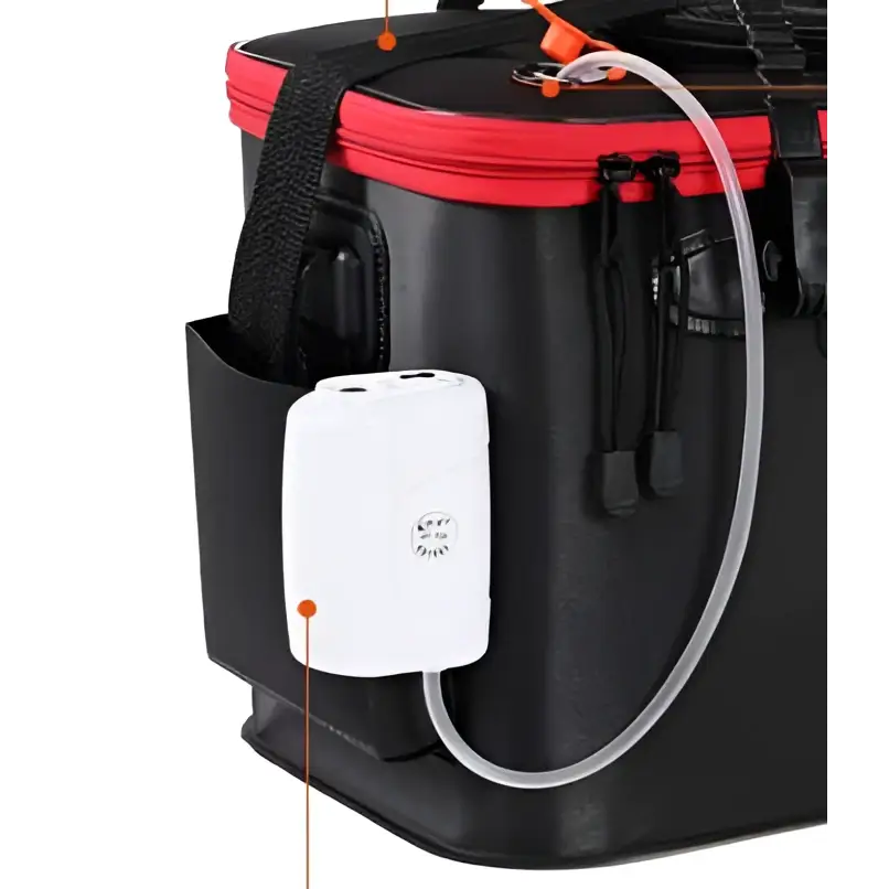 White rectangular air pump with transparent tubing attached to a black and red live fish box in portable fishing bag