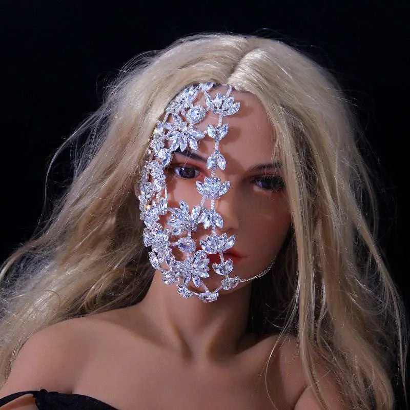 A dazzling silver fashion rhinestone mask with intricate floral designs and sparkling crystals for exaggerated fashion rhinestone style