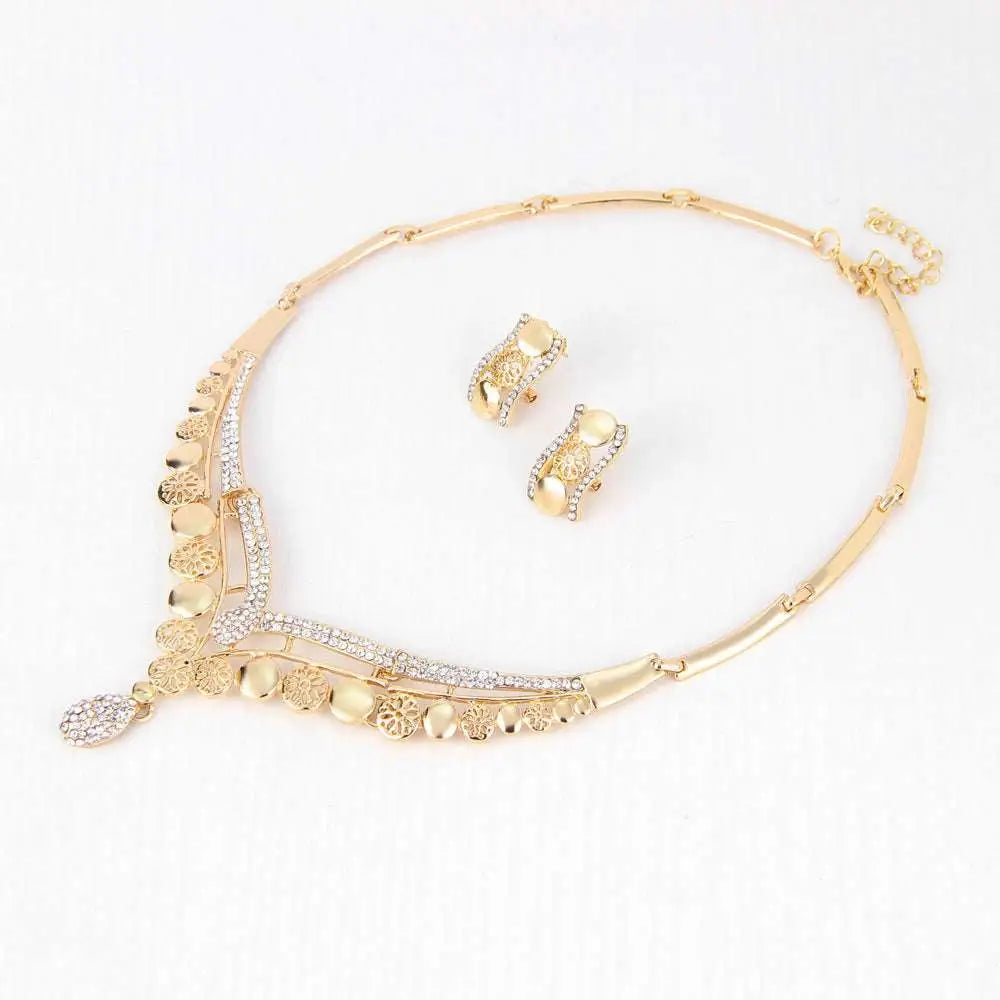 Gold-toned exaggerated jewelry sets featuring intricate coin embellishments and a sparkling crystal pendant for bridal jewelry four