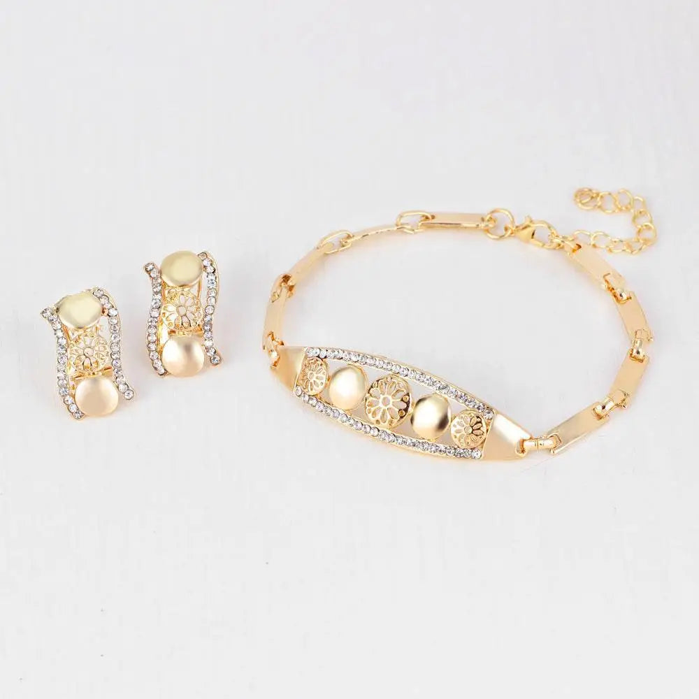 Gold-toned exaggerated jewelry sets bridal jewelry four featuring intricate filigree and teardrop crystal pendant necklace