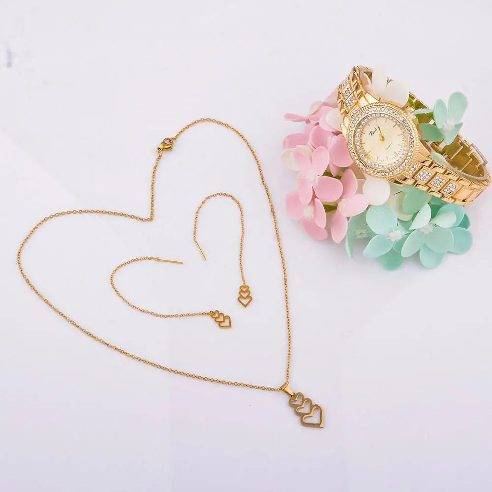 Gold heart-themed necklace set with three dangling heart charms and matching chain in an exquisite jewelry watch gift box