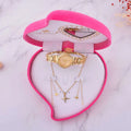 Exquisite jewelry watch with gold-toned diamond bezel and matching airplane pendant necklaces in heart-shaped box