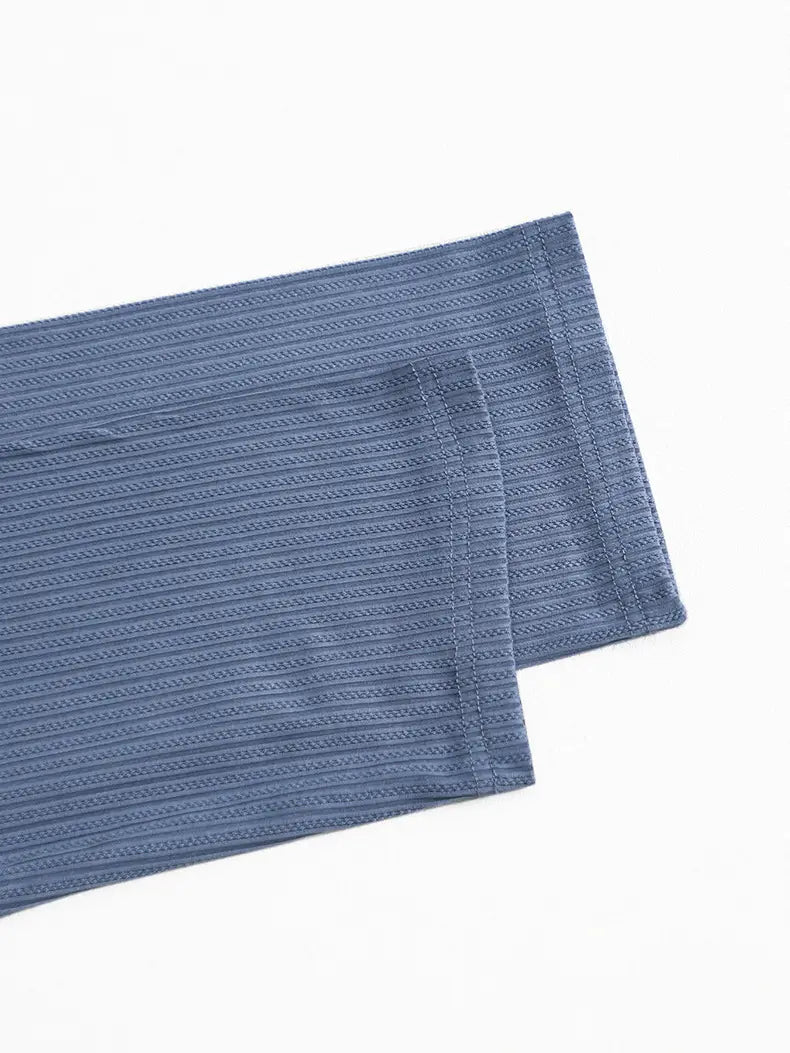 blue ribbed knit sleeve with subtle textured pattern showcasing ribbed lace ruffle detail from the black ribbed lace ruffle sleeve pajama set