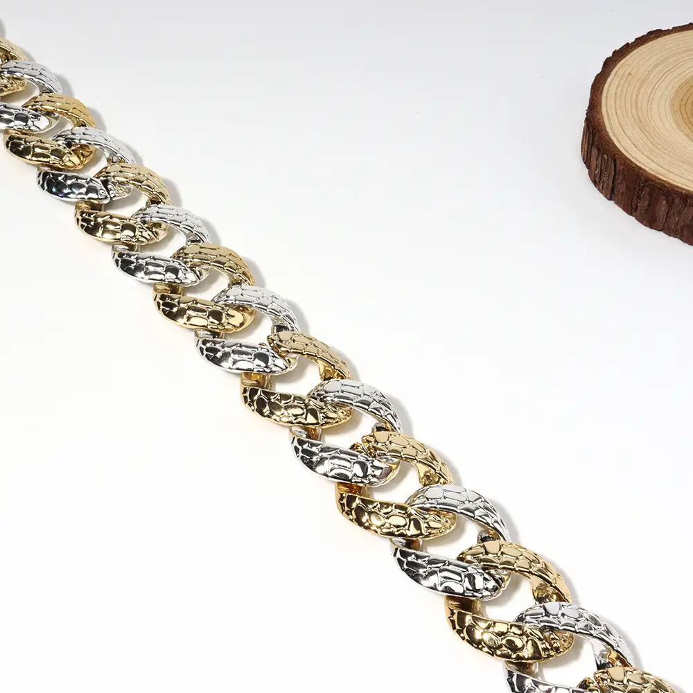 Two tone gold and silver chain summer body jewelry belt with a textured hammered finish designed for jewelry summer use.