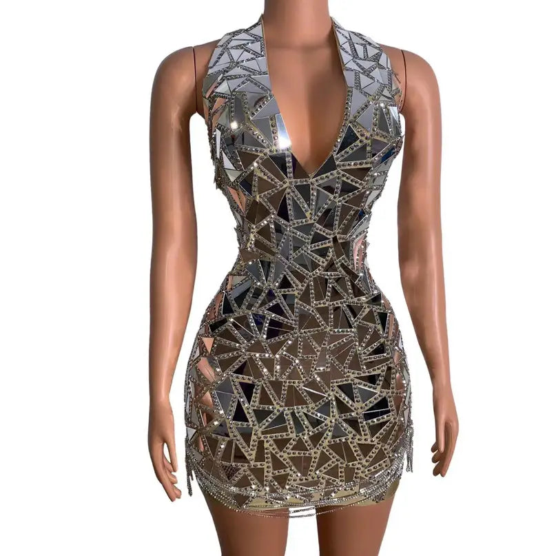 A shimmering silver mirror-paneled mini dress with a geometric triangle pattern and beaded trim designed for nightclub dj female and stage nightclub performances.