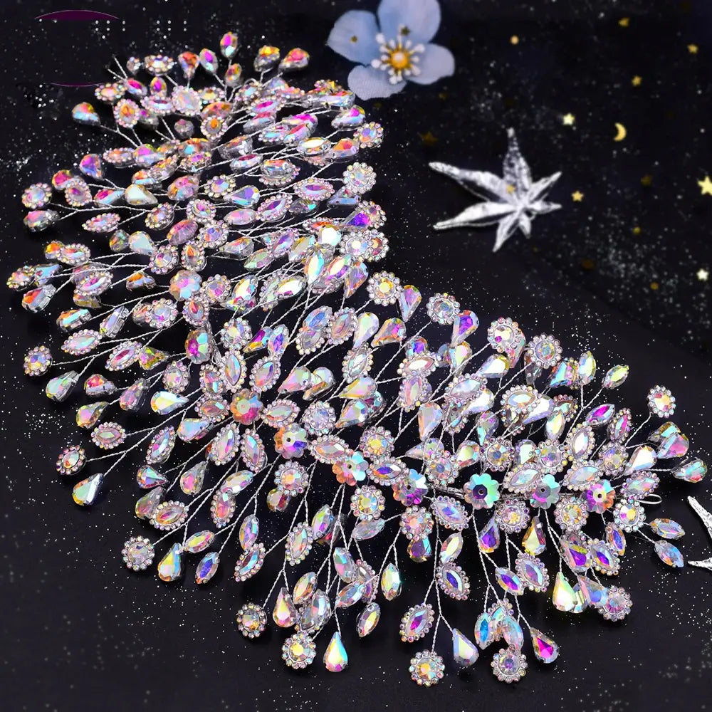 silver crystal leaf styling hair accessories featuring a shimmering iridescent crystal design with a delicate silver wire base and cascading teardrop-shaped rhinestones for elegant styling hair.