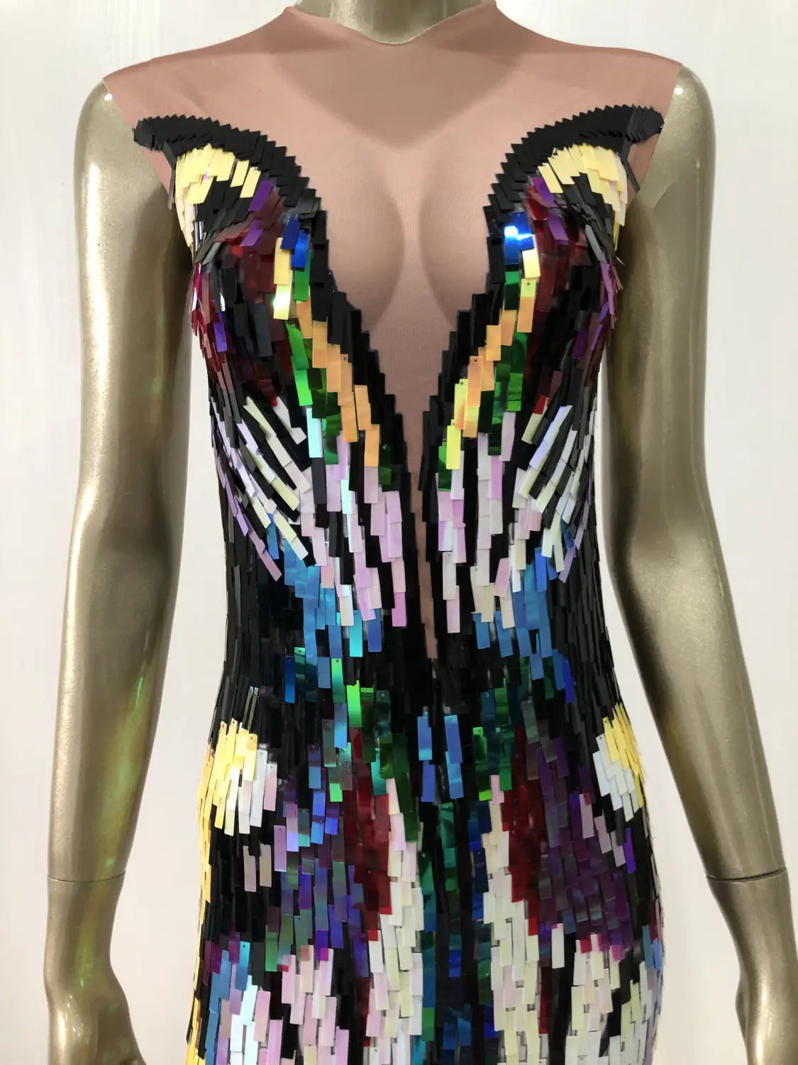A dazzling sequin evening dress featuring a form-fitting silhouette and a vibrant mosaic of multicolored sequins arranged in an intricate wing-like pattern, ideal as an evening dress female singer costume.