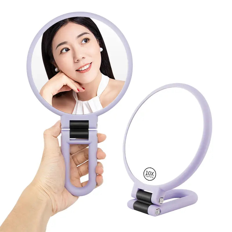 Lavender-colored handle mirror purple foldable with 10x magnifying lens and ergonomic handle for precise close-up viewing.