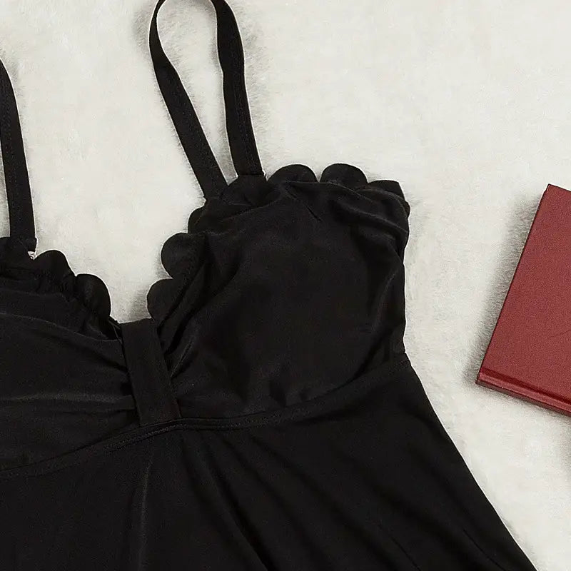 black satin camisole with scalloped edge and thin straps as part of a plus size bottoms two piece set