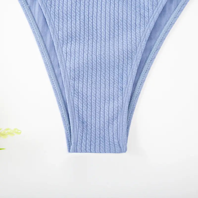 light blue ribbed knit bikini bottom with a smooth seamless finish from a white ribbed sexy bikini set with gold ring accents perfect for bikini set summer and tie thong bandage styles.