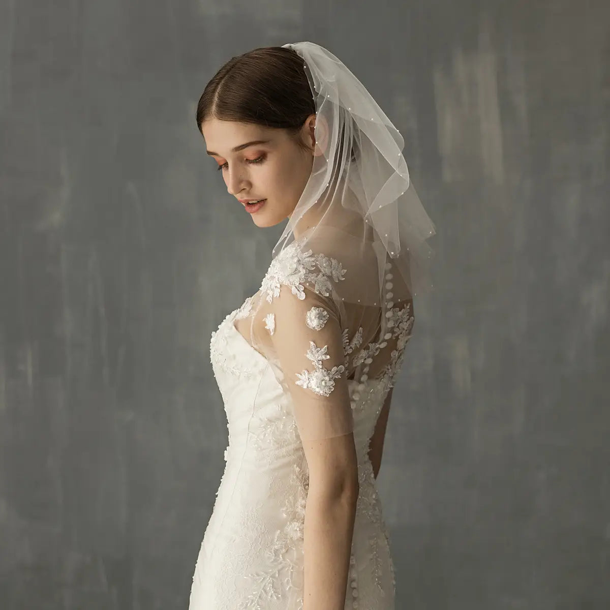 White lace retro short wedding veil with delicate floral embroidery and subtle beading along the edge designed as a wedding bride headdress.