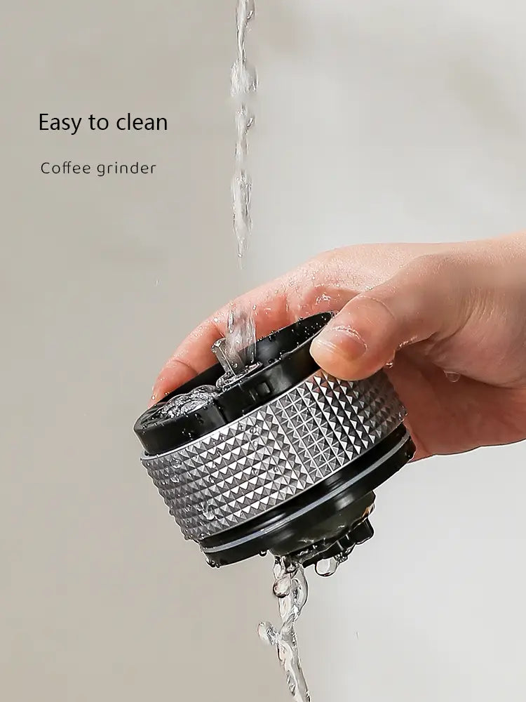 silver and black portable electric ceramic coffee grinder with a textured diamond-patterned body and usb charging capability