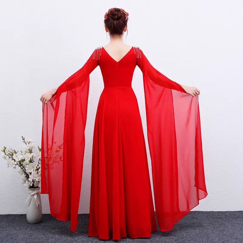 A vibrant red long guzheng performance dress featuring a floor-length design with long sheer sleeves and a v-neckline adorned with delicate beading at the shoulders.