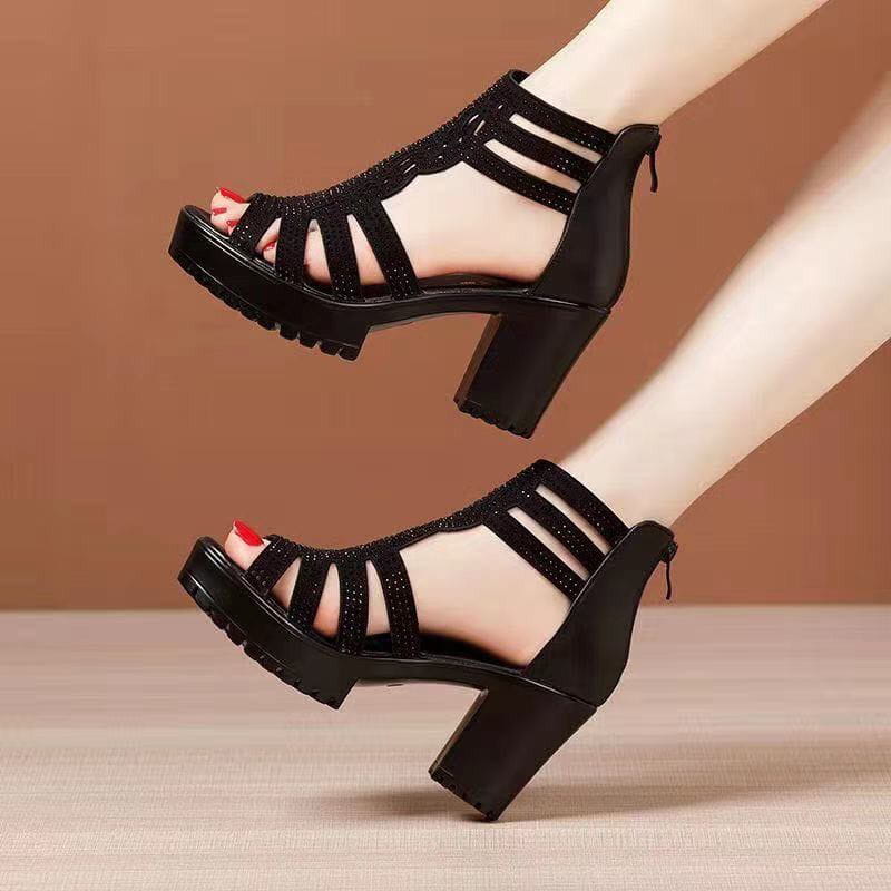 Black fish mouth medium platform sandals featuring a chunky heel and decorative straps adorned with sparkling rhinestones.