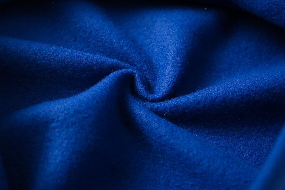 rich royal blue woolen fabric with soft textured surface and subtle sheen used in white heart paw printed hoodie sets featuring a black logo printed hoodie design