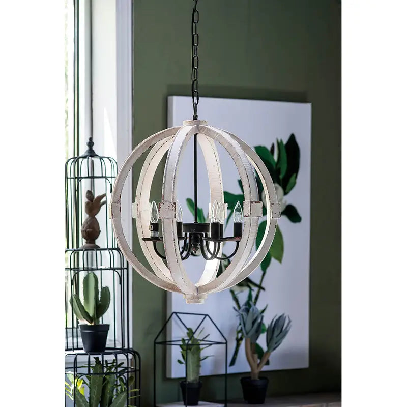 Rustic white globe light wood chandelier featuring a distressed wood sphere with black metal accents and five candle-style bulbs.