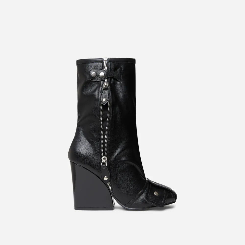 black leather high heel short tube boots with a chunky wedge heel and zipper closure