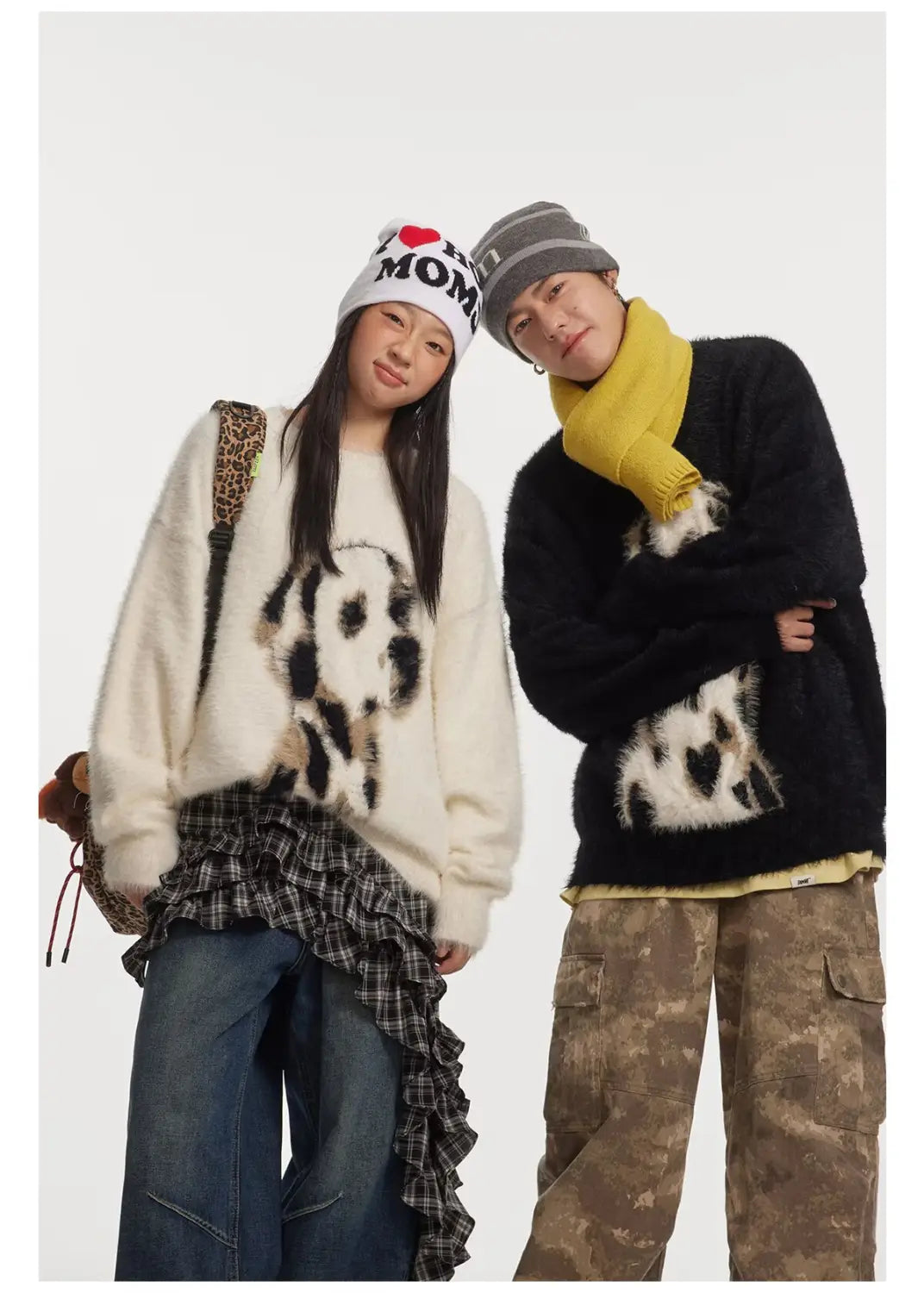 cream-colored fluffy knit sweater featuring a black and white dalmatian graphic made from jacquard mink cashmere knitted fabric