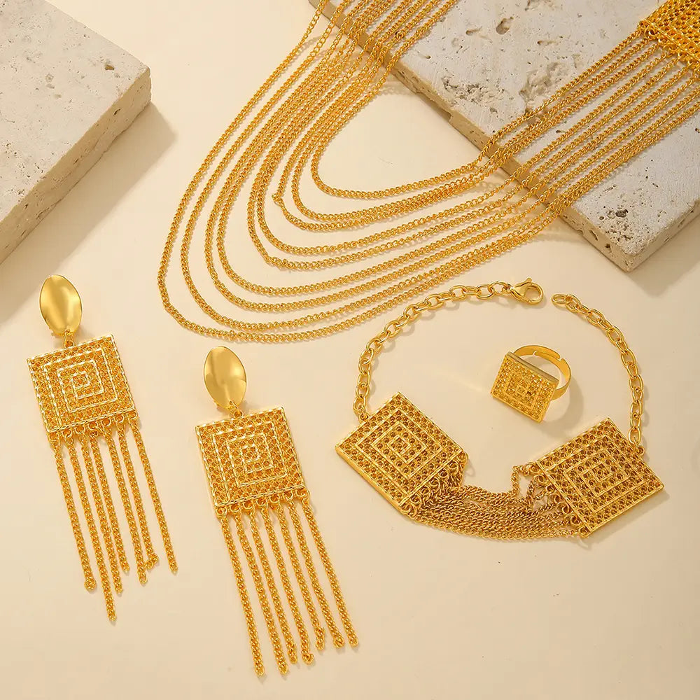 gold plated 5pcs fashion ladies 18k gold plated jewelry set featuring intricately designed geometric layered chains with square-shaped pendants and fringe detailing.