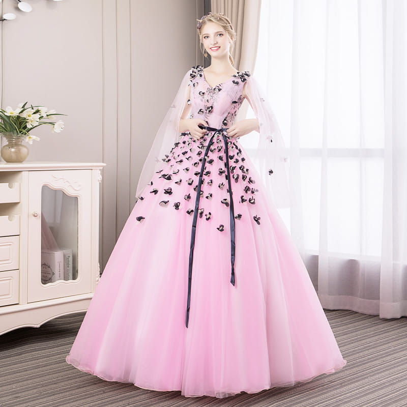 a delicate pink long skirt with black floral appliqués and a sheer capelet cinched at the waist by a matching satin ribbon designed for vocal choral art exam performances