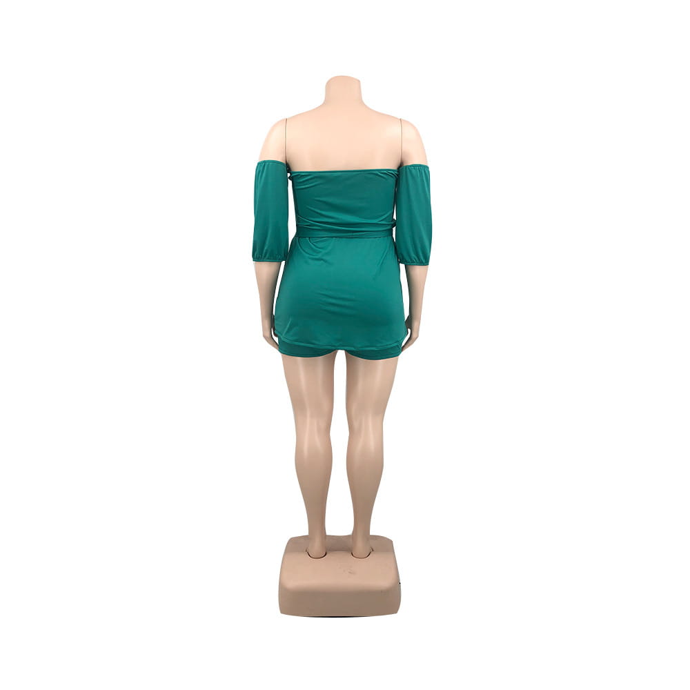 Plus size ladies emerald green off-the-shoulder romper with comfort stretch shorts three-quarter sleeves and a fitted waist.