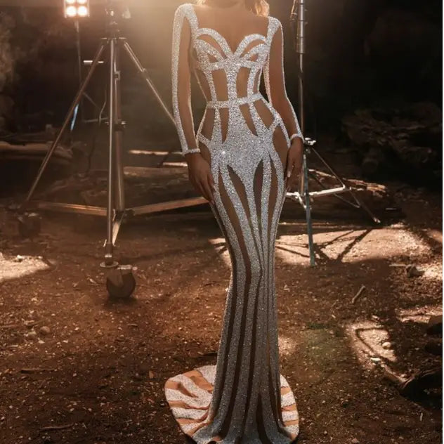 silver sequined sprinkled gold banquet evening dress featuring a fitted silhouette with long sheer sleeves and bold geometric cutouts for a sophisticated gold banquet dress look.