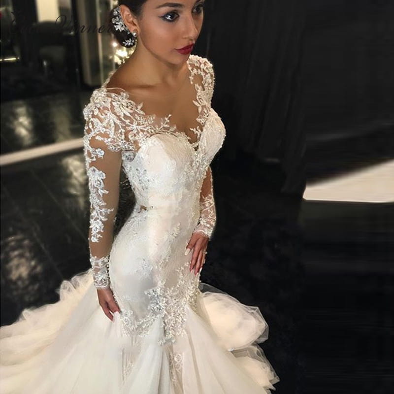 Elegant white mermaid-style wedding gown made of polyester fiber featuring intricate lace detailing and long sheer sleeves, designed as a trailing white temperament long lace wedding dress.