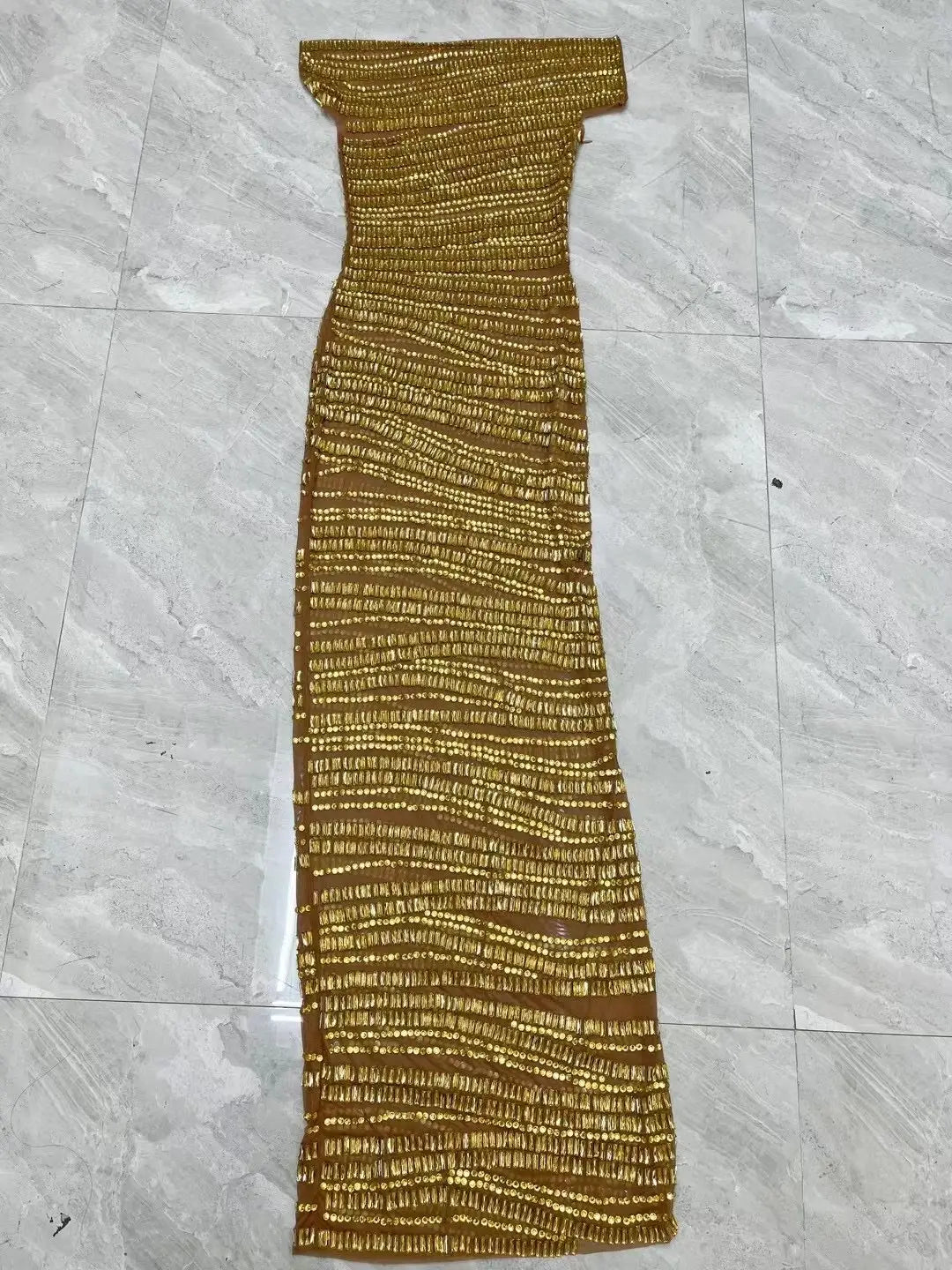 a sexy luxury shiny off-the-shoulder gold maxi dress featuring a textured ribbed knit pattern in a luxury shiny rhinestone style