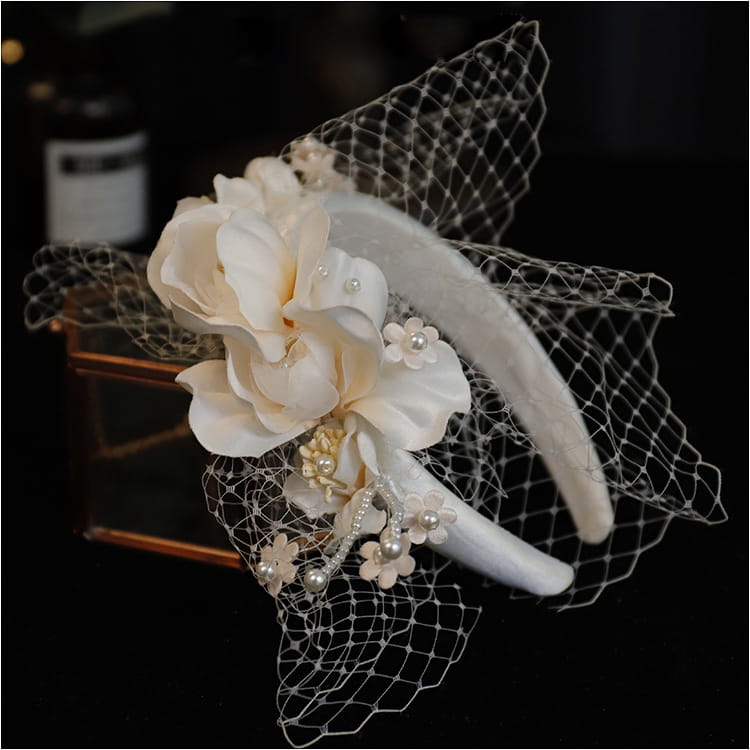 Elegant ivory pearl lace petal mesh hairband featuring delicate lace and pearl embellishments for a refined look.