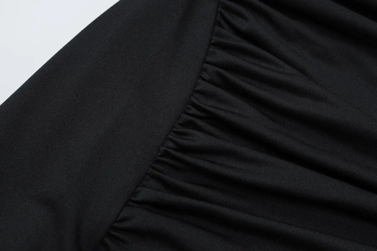 black ruched fabric with a smooth slightly textured surface featured on a sexy hot girl long sleeve hollow out dress