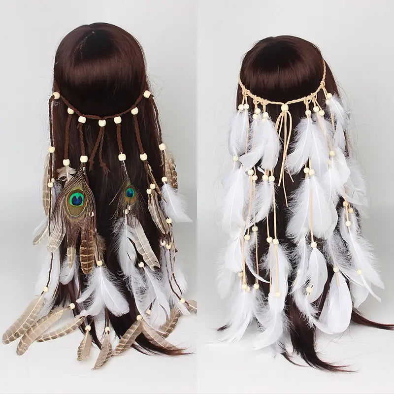 A delicate white feather hairband hair accessory features a bohemian design with white and brown feathers including peacock feathers with iridescent green eyes strung along light-colored cords and accented with small cream beads.