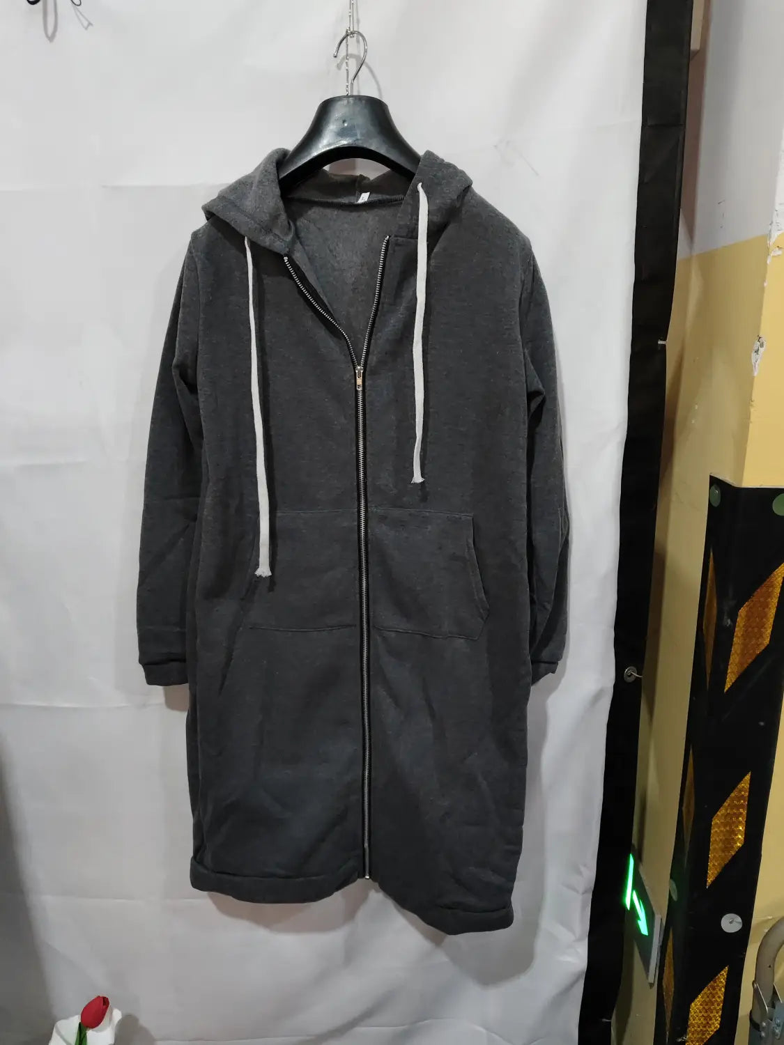 dark gray hooded zip-up coat with white drawstrings and two front pockets designed as a women zip up long thick hooded winter sweater for cold weather wear