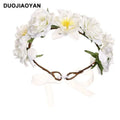 White fabric colorful rose flower garland hair accessory with artificial blossoms green leaves and brown vine base