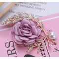 A delicate lavender satin fabric flower lady temperamental pin floral brooch set with gold leaves rhinestones and pearl accents