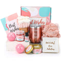 Rose-scented candle in a gold-rimmed tin with pink and teal label in a fabulous tumbler and fizzing bath salts gift set