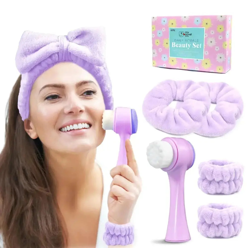 Purple facial cleansing brush with white and purple silicone face-washing head for daily skincare routine