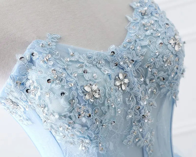Light blue slim fit bridesmaid gown featuring delicate lace with intricate floral embroidery and silver rhinestone beading ideal for annual meeting events.