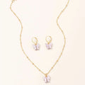 Gold chain necklace with lavender resin butterfly pendant and matching gold hoop earrings in creative fashion resin set