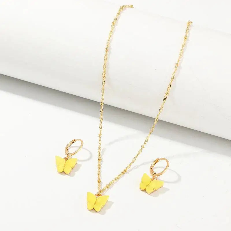 Gold-toned creative fashion resin butterfly necklace and matching earrings with delicate chains and lever-back closures