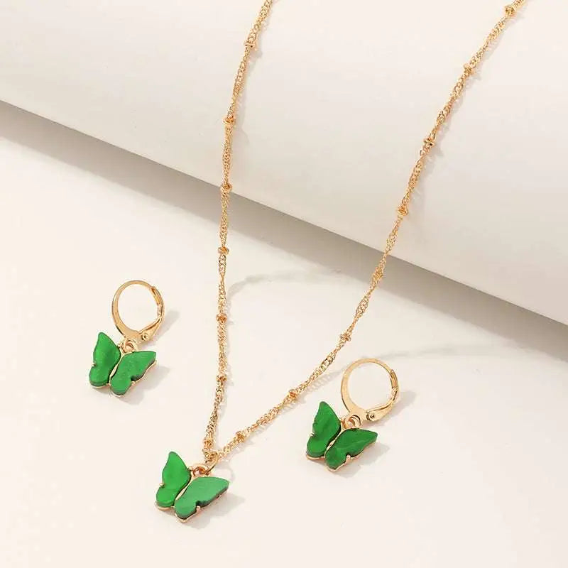 Fashion resin butterfly necklace set with green pendant and matching gold hoop earrings for creative fashion style