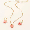 Gold chain necklace with pink resin butterfly pendant and matching gold hoop earrings fashion resin necklace set