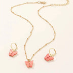 Gold chain necklace with pink resin butterfly pendant and matching gold hoop earrings fashion resin necklace set
