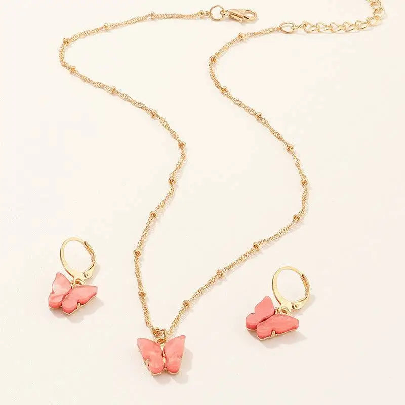 Gold chain necklace with pink resin butterfly pendant and matching gold hoop earrings fashion resin necklace set