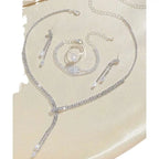 Silver rhinestone necklace with delicate chain links and clear crystal drop design from necklace earring bracelet set