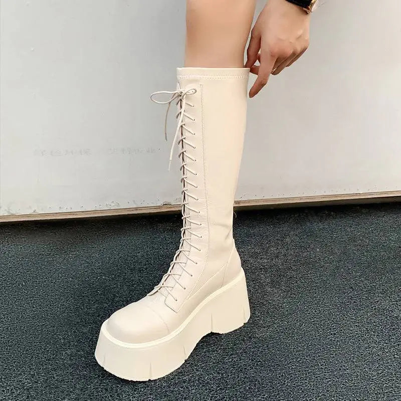 Cream-colored fashion white platform leather knee-high boots with lace-up front and thick platform soles