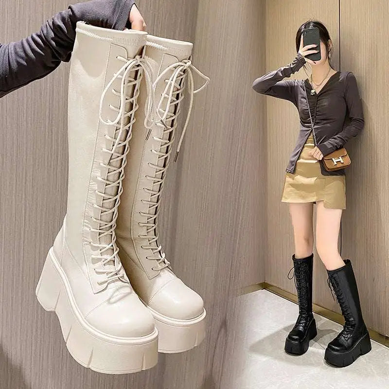 Cream-colored fashion leather knee-high boots with glossy finish, thick platform soles, and matching laces for style